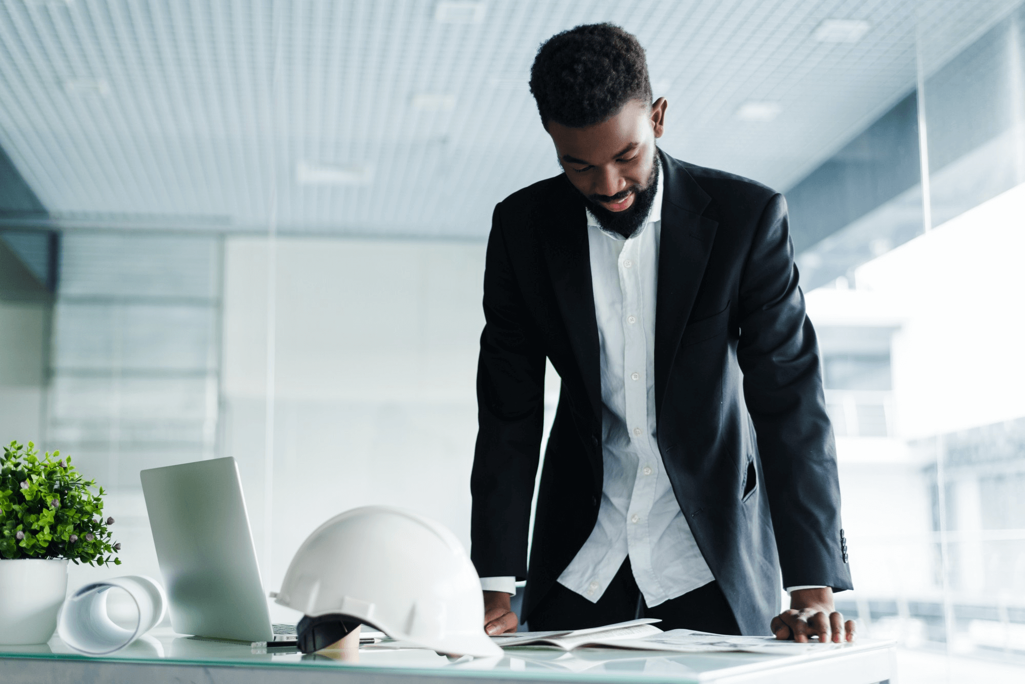 Image of man reading building compliance documents